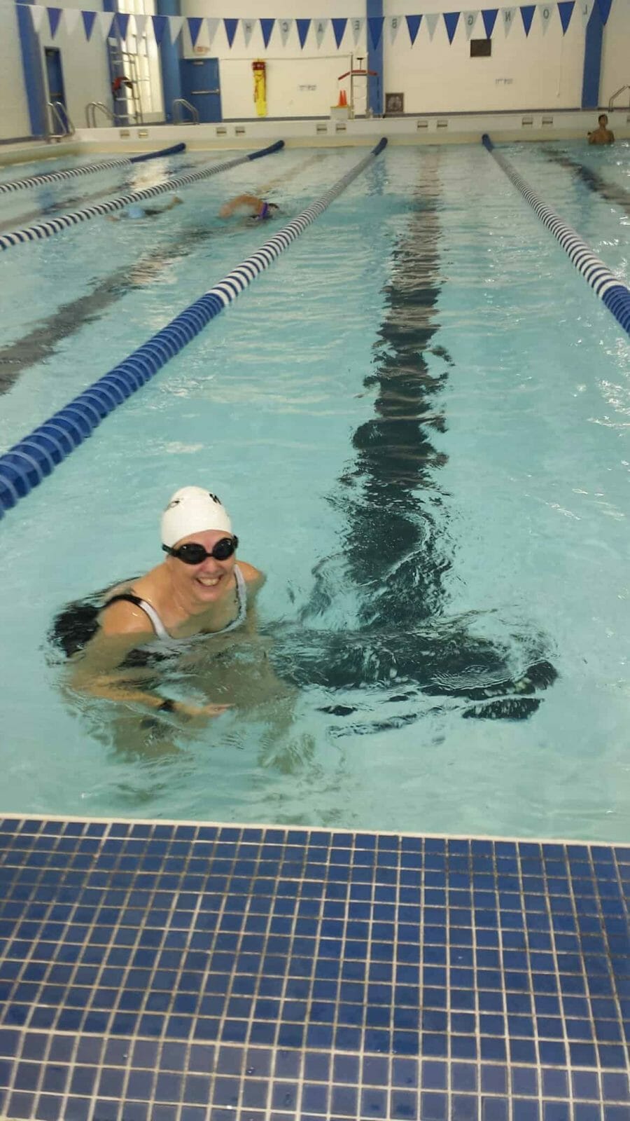 Hilary swimming in a pool