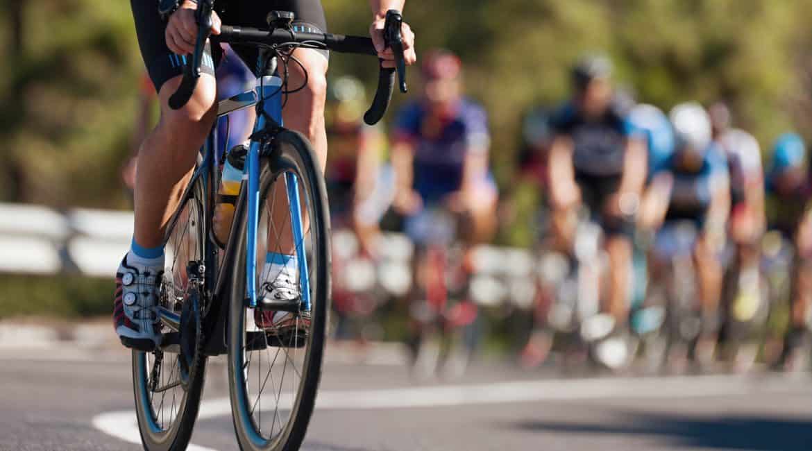 group of cyclists riding