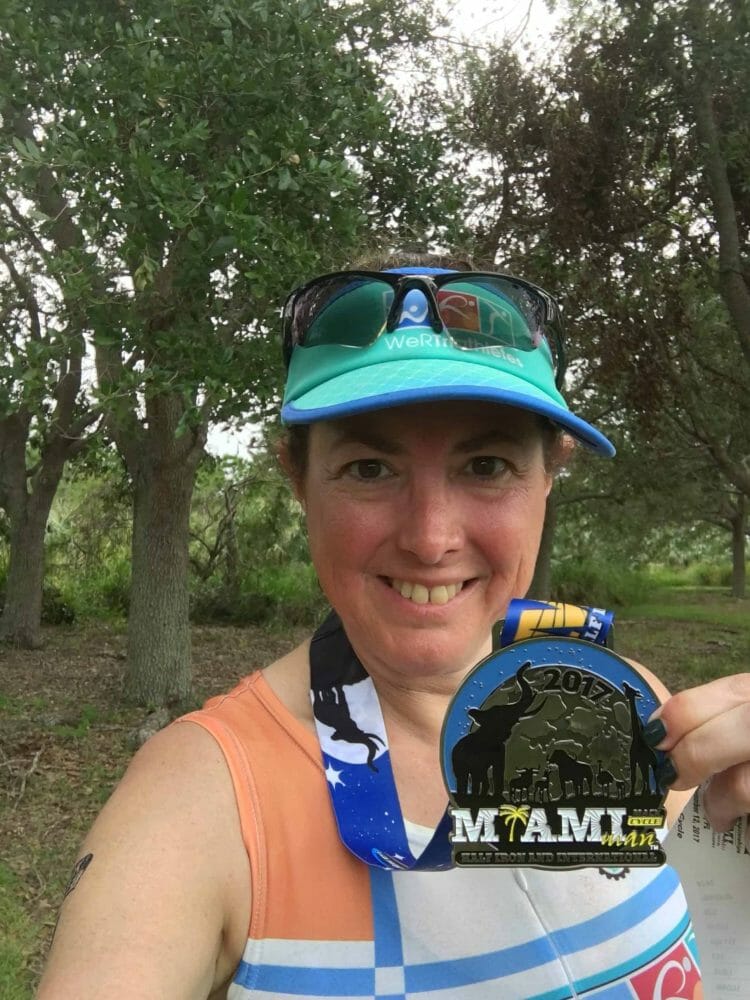 Hilary Topper with her medal from Miami Man Triathlon