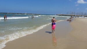 walking on beach in tel aviv