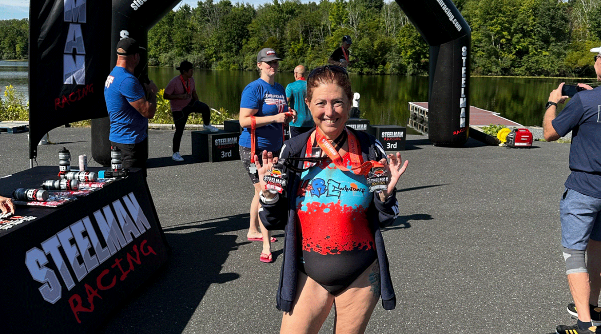 Hilary with her medals from Steelman Racing Open Water Swim Classic 3 mile Race