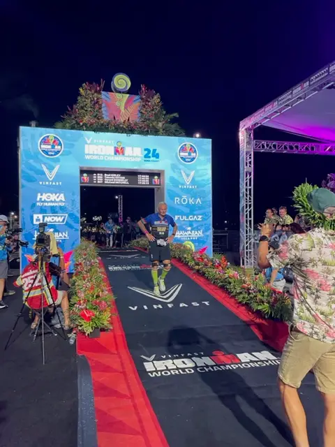 Brad Kirley finishing his 12 Ironman